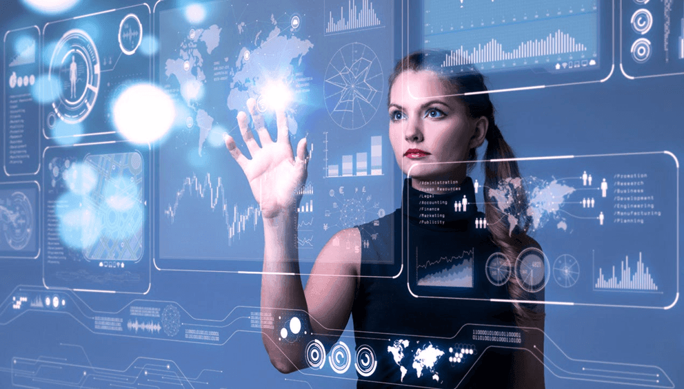 Woman interacting with futuristic digital interface displaying charts and maps on a transparent screen.